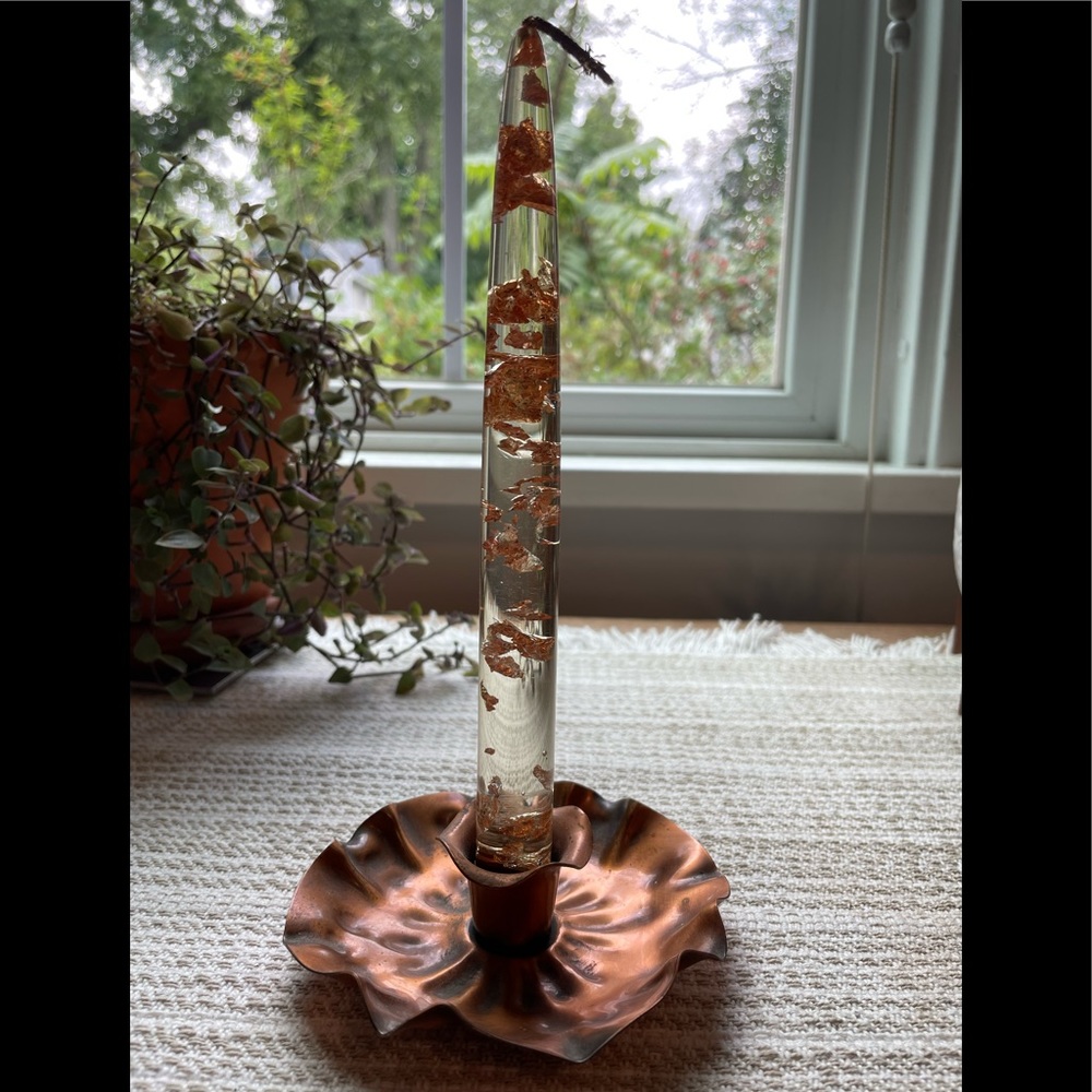 Vintage lucite candle with gold flakes and Gregorian copper candle holder.